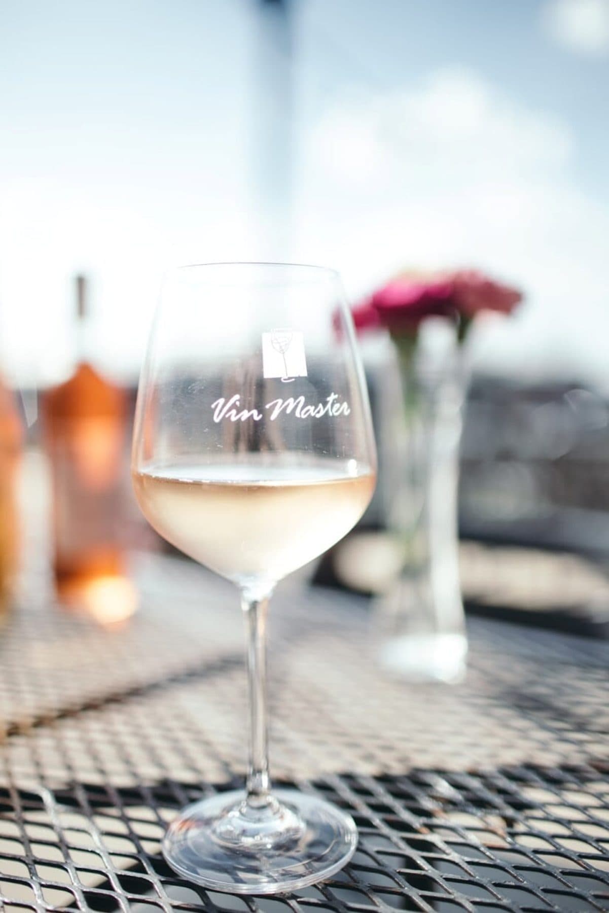 A glass of white wine on the Vin Master patio